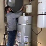 Man fixing Tankless Gas Hot Water Heater